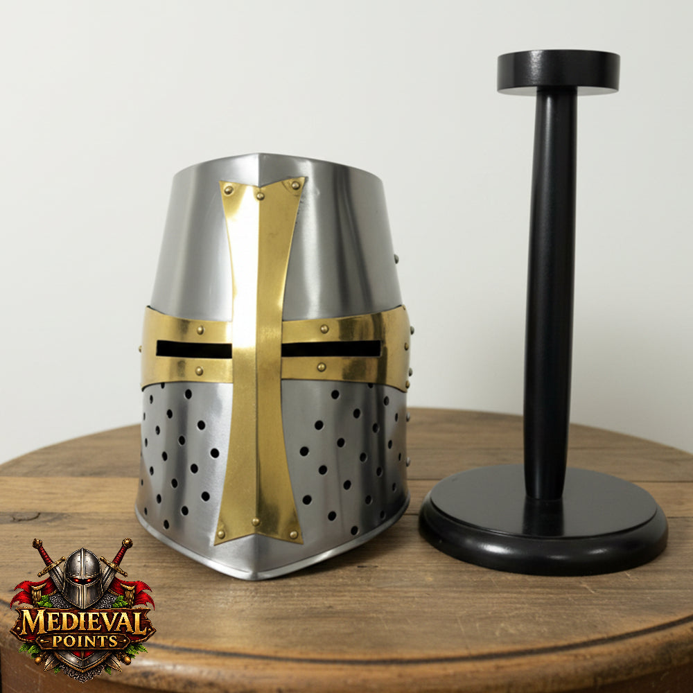 Metal helmet with gold accents on a wooden stand against a white background, 